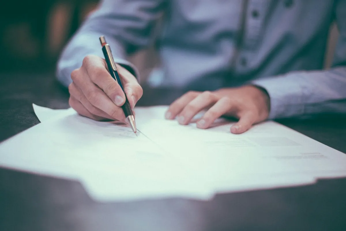 Professional reviewing and signing a notice letter