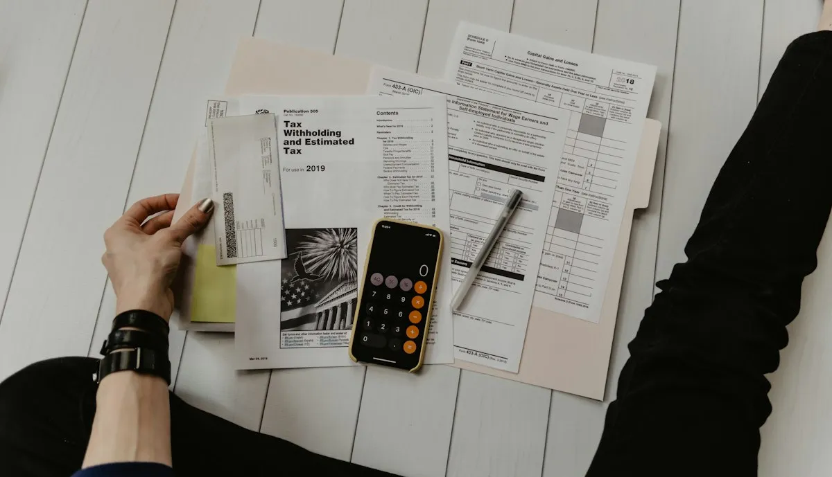 Tax forms, receipts and a calculator on a desk